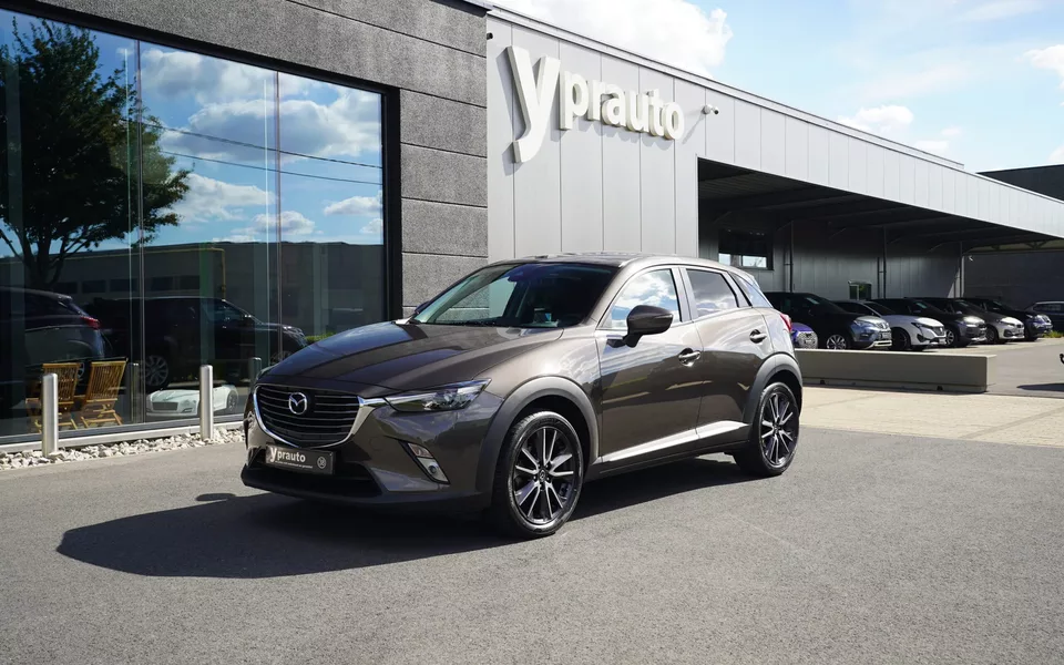 Mazda CX-3 2.0i SKYACTIV-G Aut Leder Camera Trekhaak Navigatie 18″ Alu Parkeersensoren Cruise RadioCD Verwarmde zetels Klimaatregeling Privacy Laneassist
